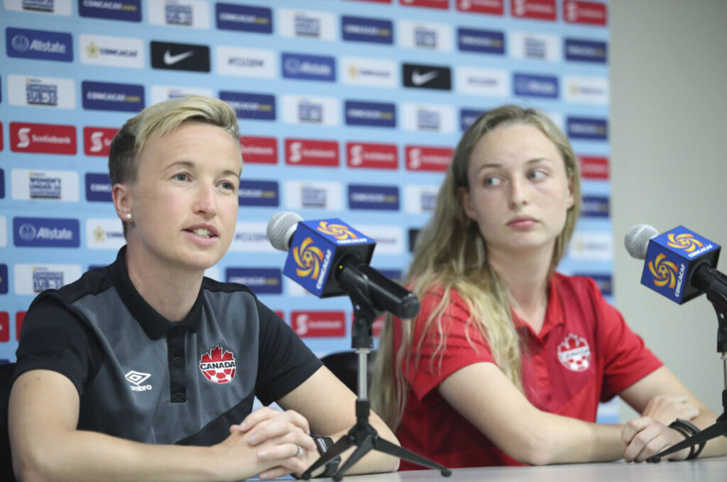 Current Canada Manager Bev Priestman and defender Gabrielle Carle at a press conference for the 2018 CONCACAF Women's U-20 Championship