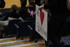 A sign in the crowd at a Humber men's volleyball game showing support for Andrew Blakey. (Photo: Benedict Rhodes)