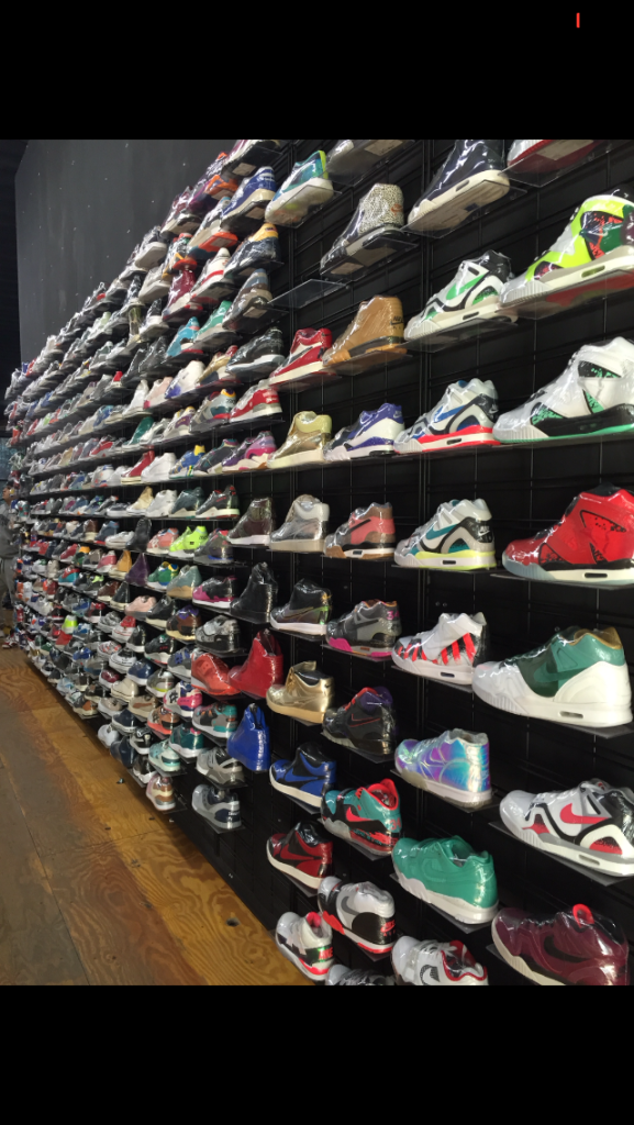A wall display of shoes.