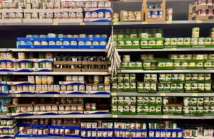 Canned goods stacked on a shelf