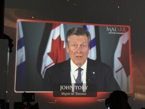 A projector with Mayor John Tory on it.