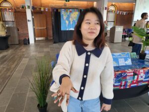 20 year old transfer student from Vietnam shows off her brand new henna tattoo gotten at the Culture Day event.