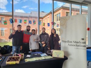 The Muslim Student Association (from left to right): Saifkhan Pathan, Ethan Ratos, Sabber Reza, Omar Ismail, and Lubnaa Aamirah, a volunteer alumni.